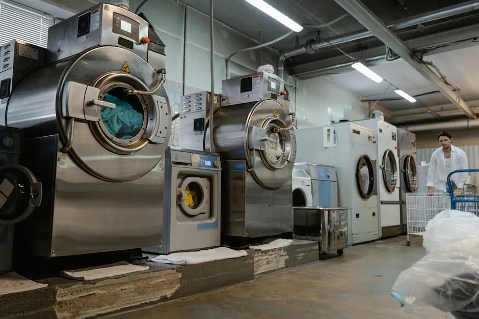 Industrial laundry machines in a commercial service facility