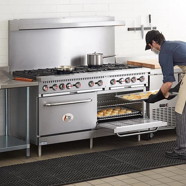 Cook working at a commercial range and oven line