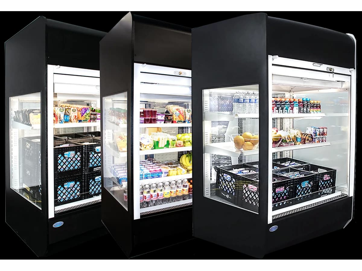 Lineup of stocked refrigerated display case merchandisers